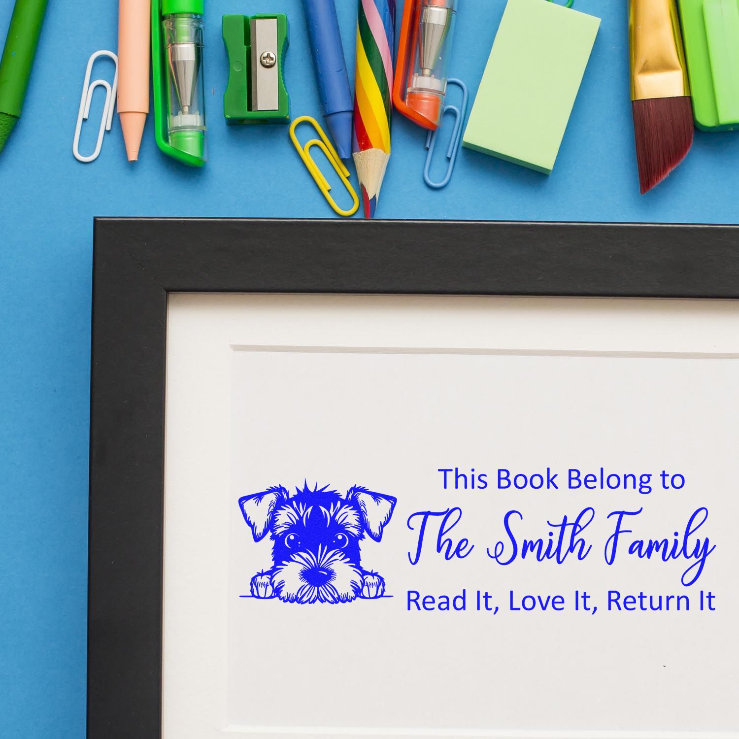 Personalized rubber stamp bookplate with dog design for The Smith Family, featuring Read It, Love It, Return It text.