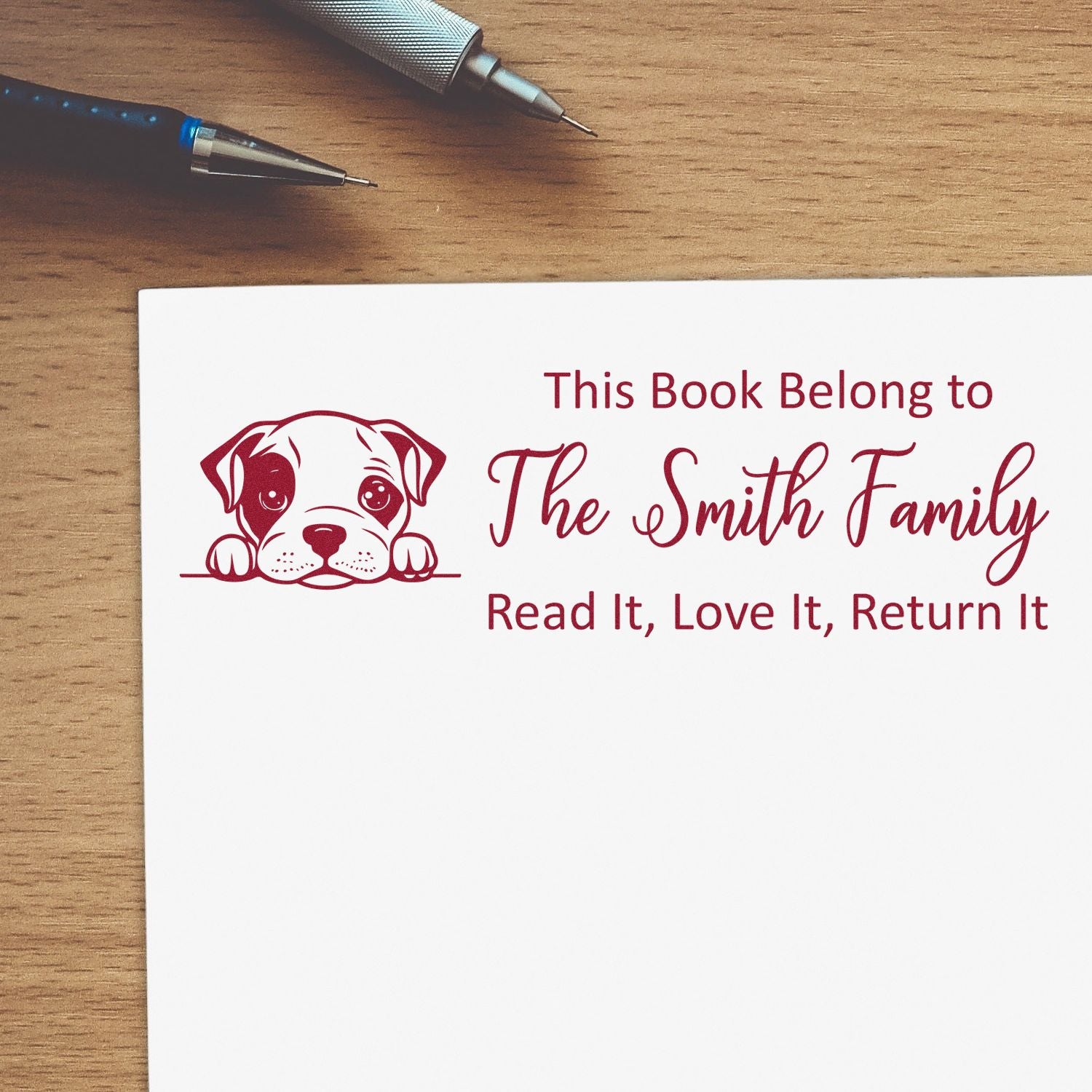 Custom dog rubber stamp with This Book Belongs to The Smith Family text for personalized library books and return reminders.