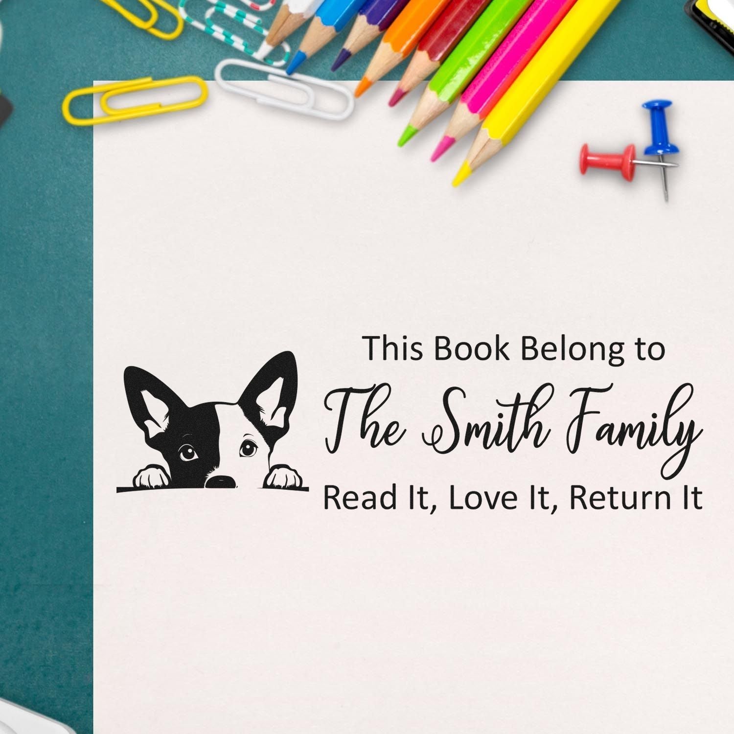 Custom book stamp for The Smith Family library books, featuring a dog bookplate and Read It, Love It, Return It.
