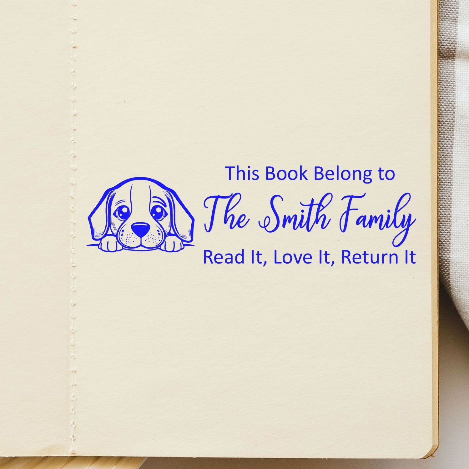 Custom dog bookplate rubber stamp for The Smith Family books, featuring puppy design and Read it, love it, return it message.