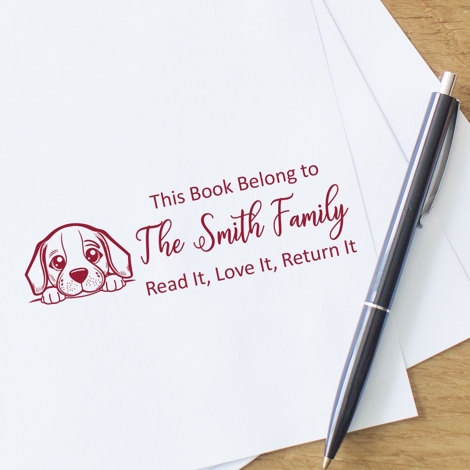 Custom rubber book stamp for The Smith Family, featuring a dog design and Read It, Love It, Return It library ownership text.