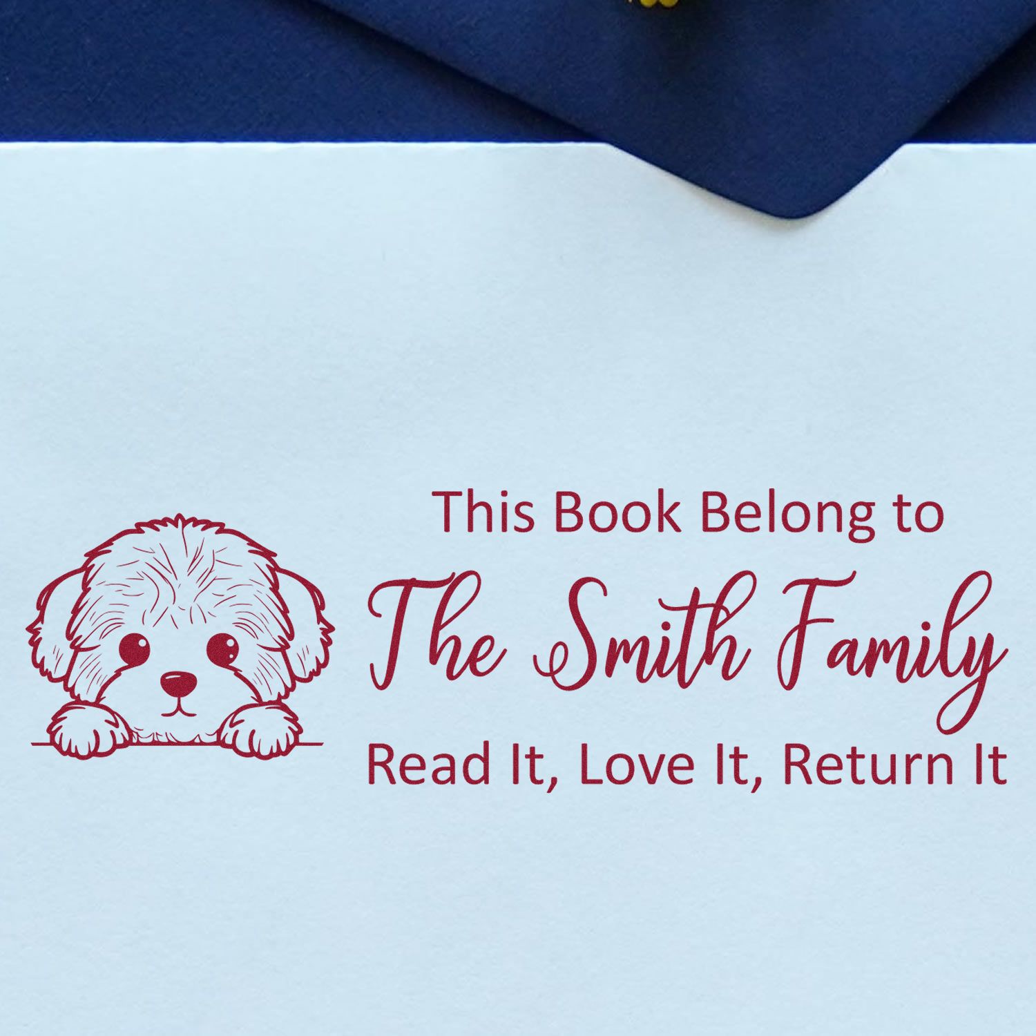 Personalized rubber stamp for books with dog illustration and family name: This Book Belongs to The Smith Family, Read It, Love It, Return It.