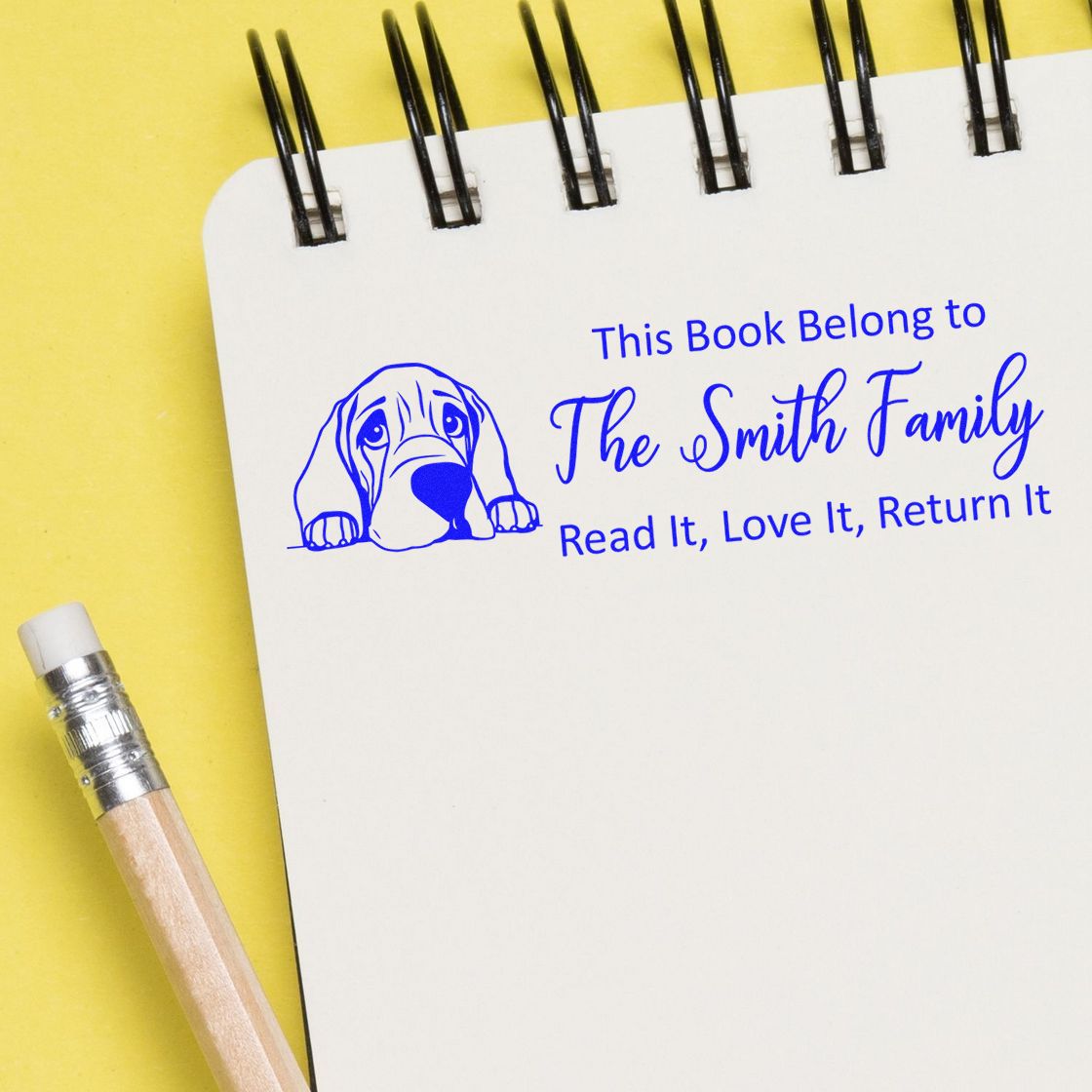 Personalized rubber book stamp with dog design, This Book Belongs to The Smith Family, for marking family library books