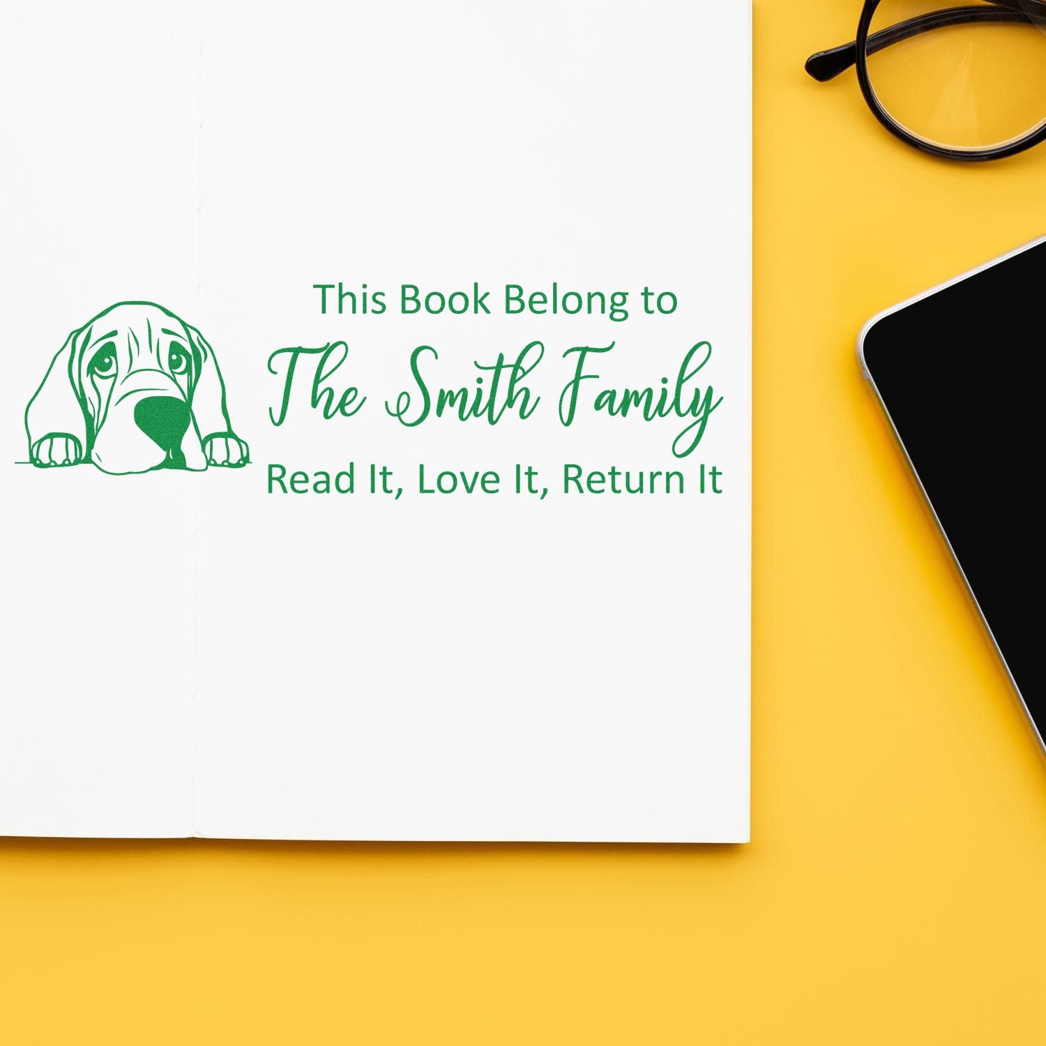 Custom bookplate rubber stamp with dog illustration and family name for personal library books.