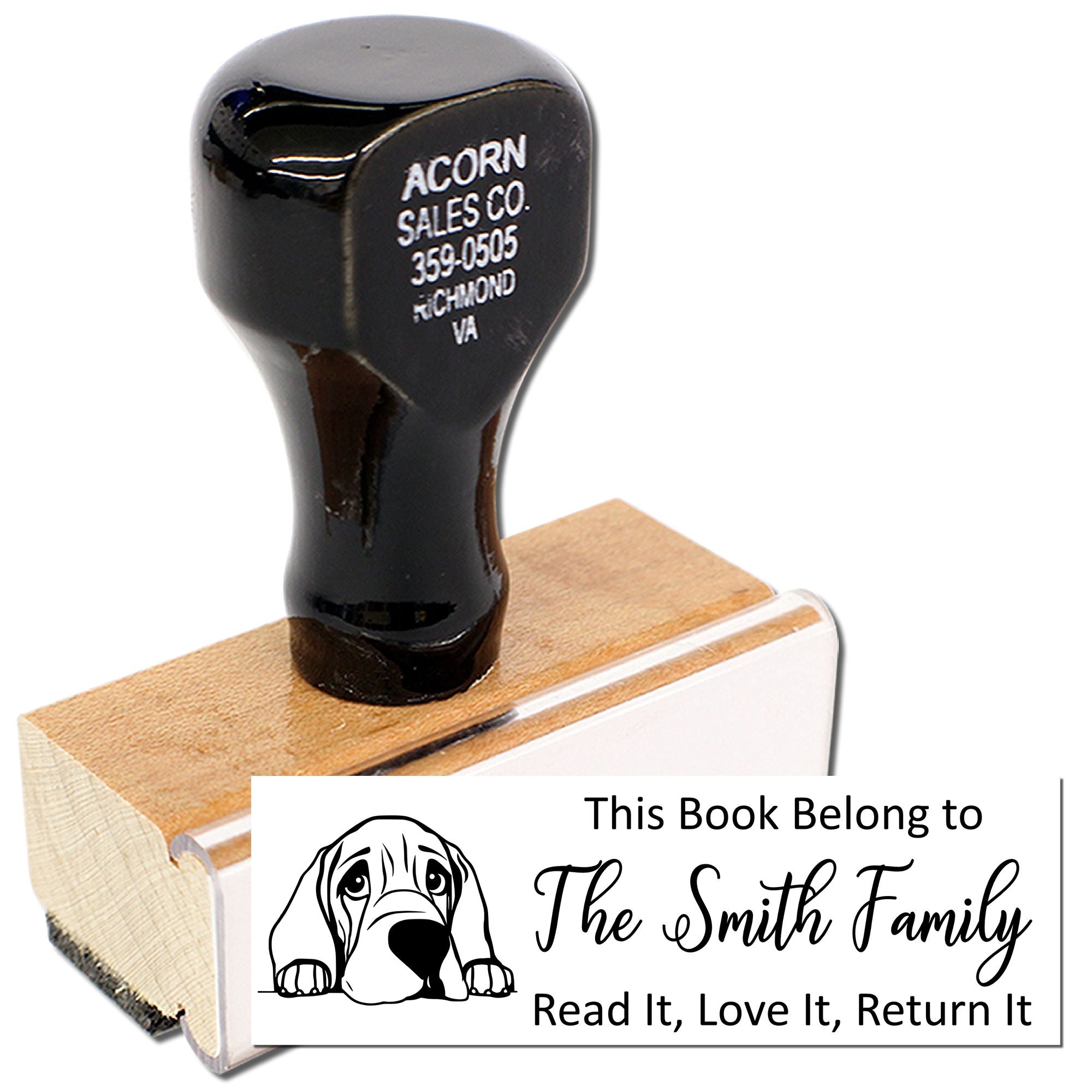 Personalized rubber stamp bookplate for marking library books, featuring a dog design and family name.