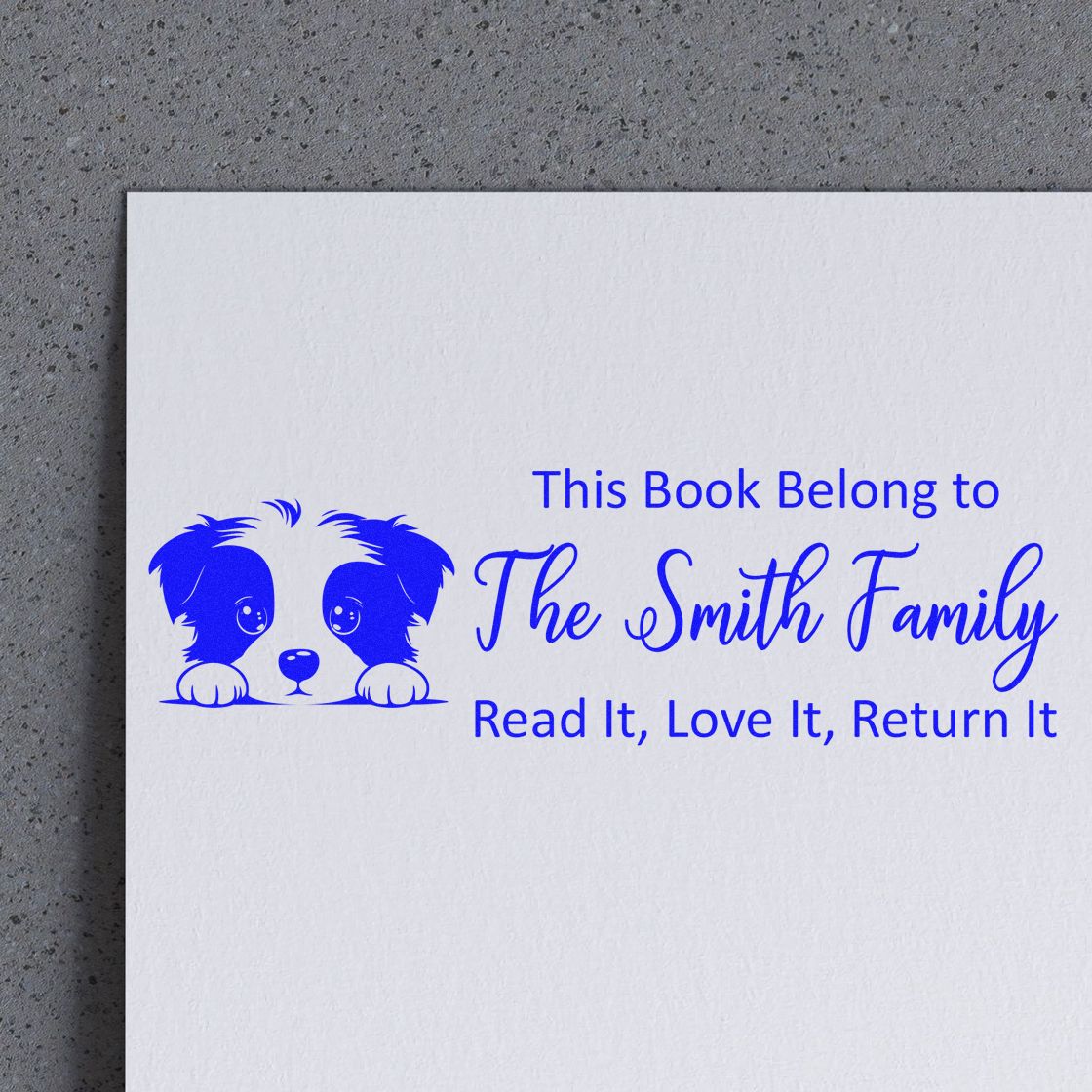 Custom book ownership rubber stamp with dog design for The Smith Family, read it, love it, return it.