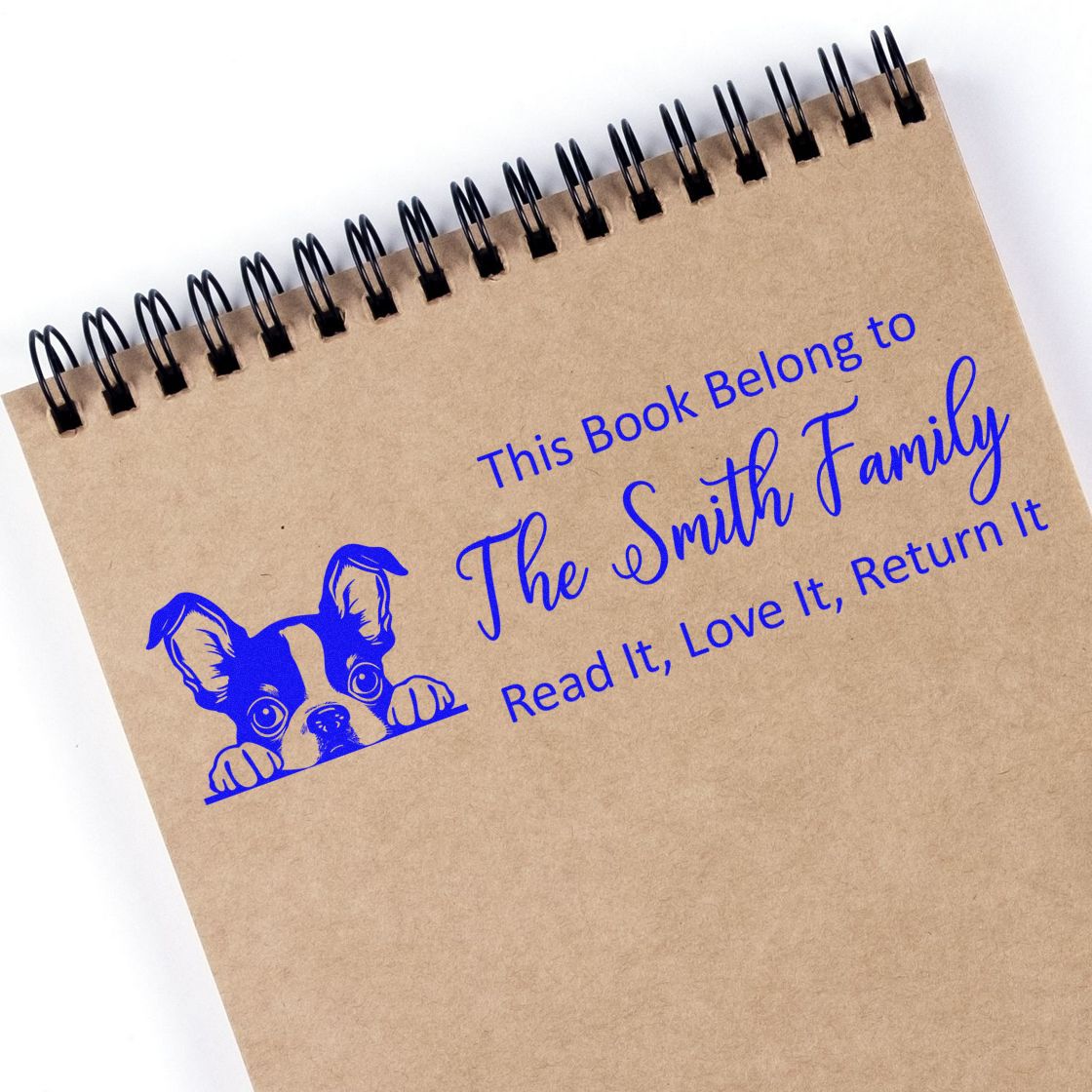 Personalized rubber book stamp with dog graphic reading This Book Belongs to The Smith Family, Read It, Love It, Return It.