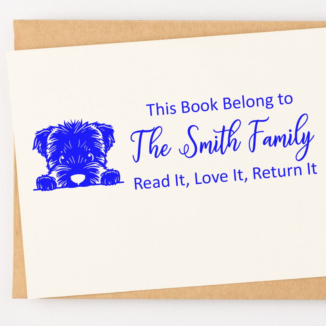 Custom bookplate rubber stamp with dog icon and family name: This Book Belong to The Smith Family, Read It, Love It, Return It.
