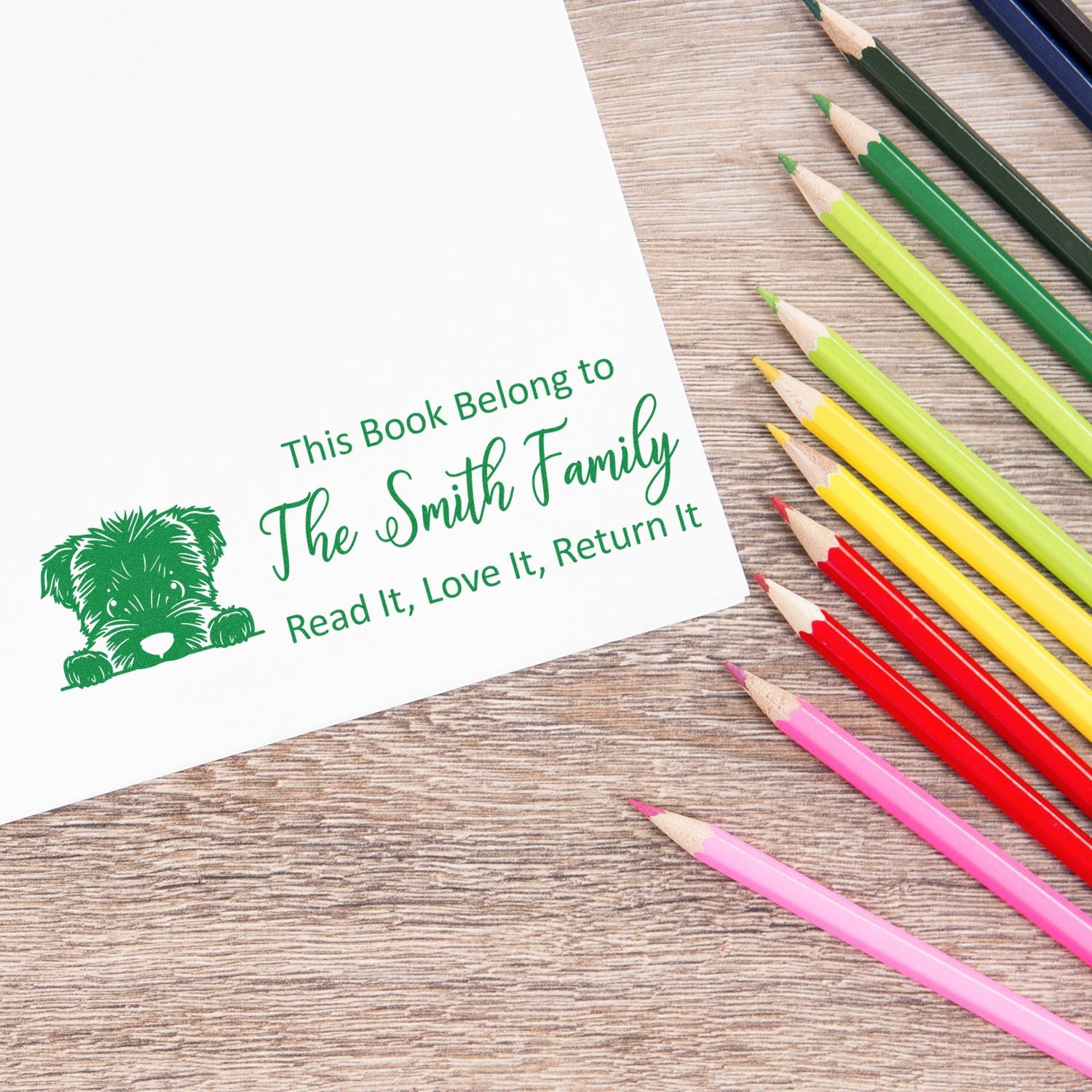 Personalized rubber stamp for books: This Book Belongs to The Smith Family with dog graphic and Read It, Love It, Return It.