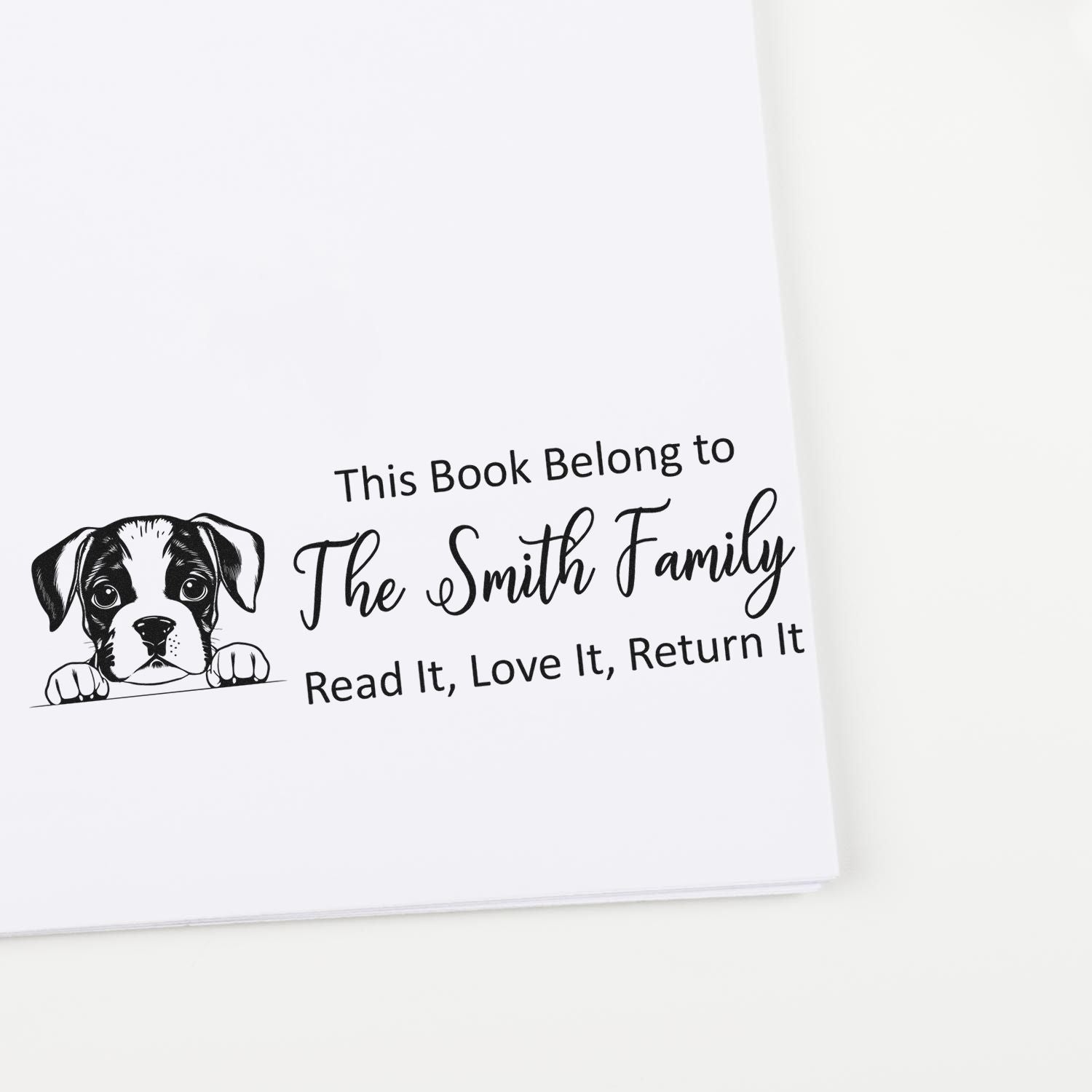 Custom rubber book stamp with puppy illustration and family ownership text: This Book Belong to The Smith Family, Read It, Love It, Return It