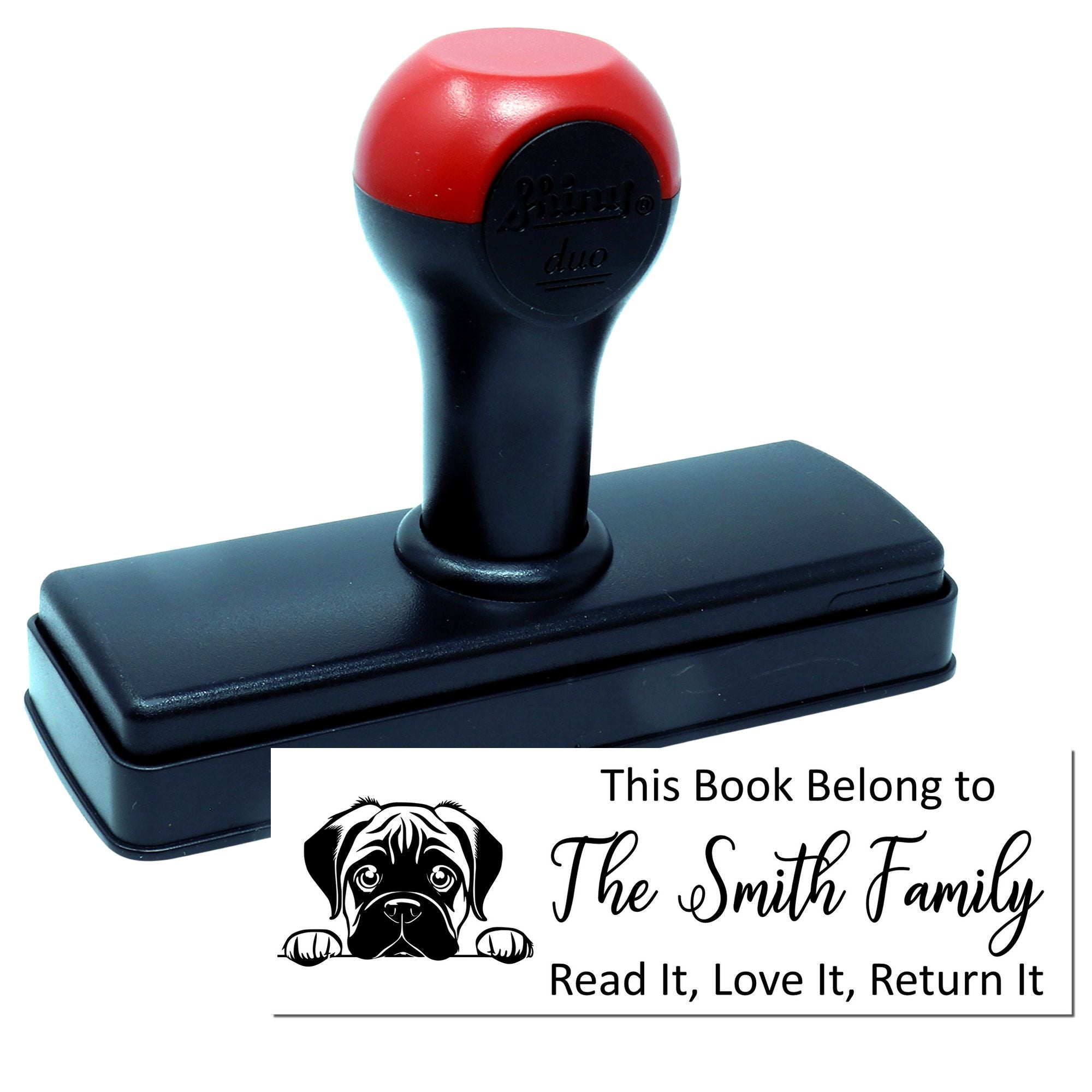 Custom self-inking book rubber stamp with This Book Belongs to The Smith Family return notice and dog illustration.