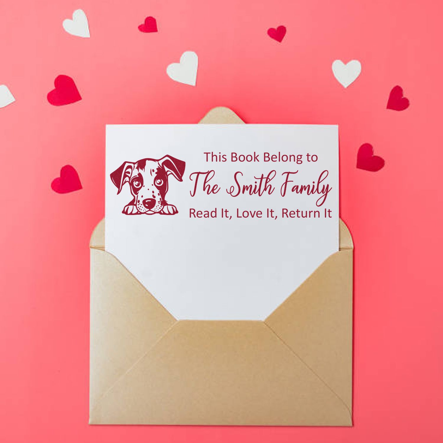 Personalized book rubber stamp with puppy design and family name for This Book Belongs To return-it labels.