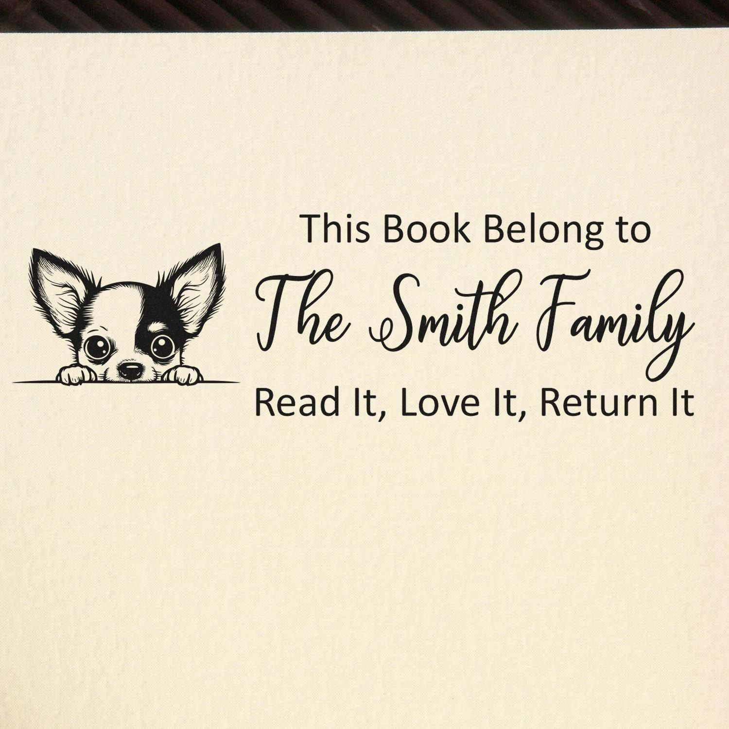 Custom book rubber stamp reading This Book Belongs to The Smith Family with cute chihuahua design