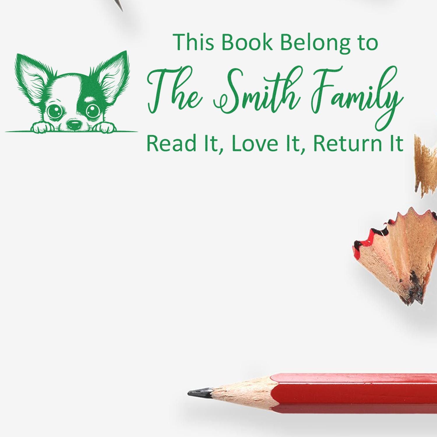 Personalized rubber book stamp with dog design and This Book Belongs to The Smith Family for library books.