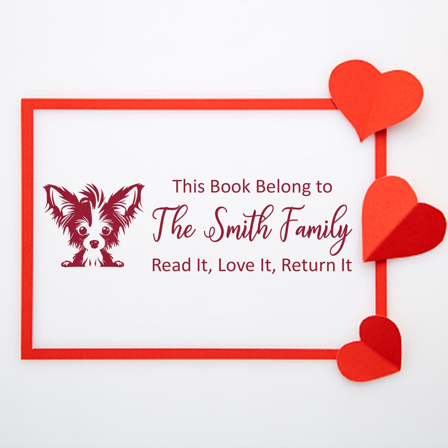 Personalized dog-themed book return stamp for The Smith Family, with Read it, love it, return it and heart accents.