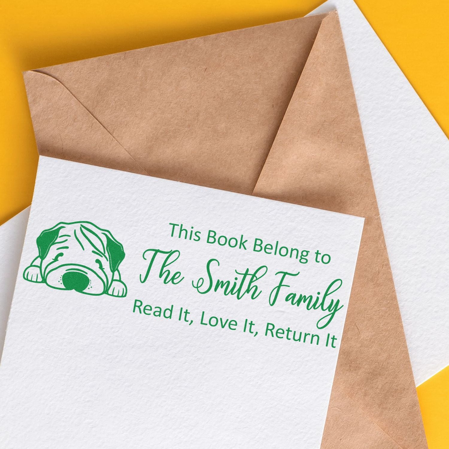 Personalized bookplate rubber stamp with dog icon: This Book Belong to The Smith Family, Read It, Love It, Return It.