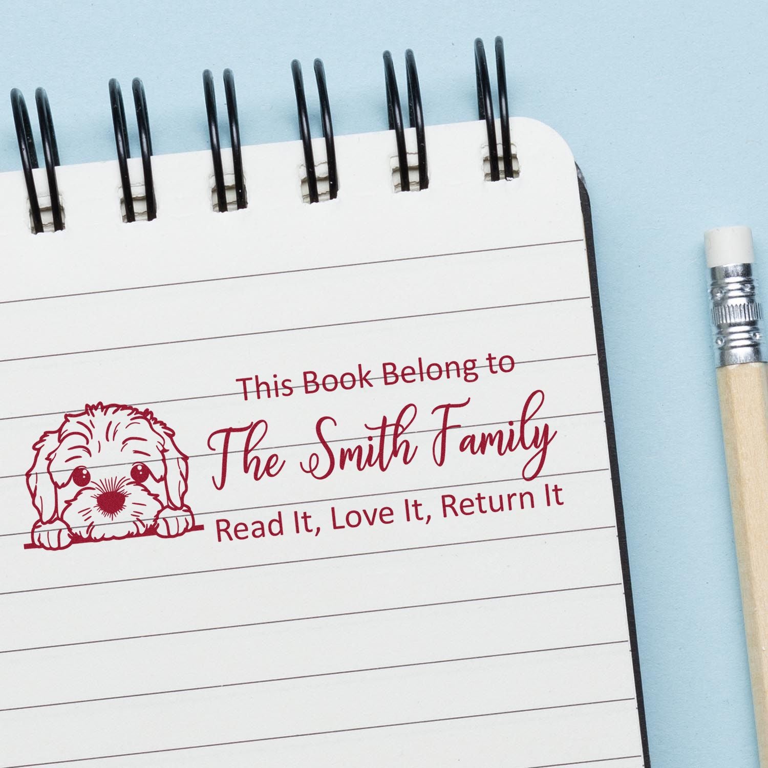 Custom book stamp with dog design for The Smith Family, marking library books: Read It, Love It, Return It.
