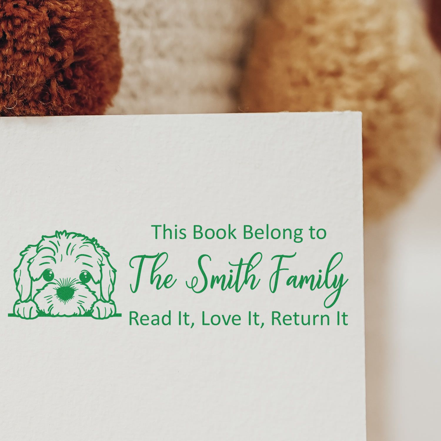 Custom rubber book stamp for The Smith Family with dog design and Read it, love it, return it personalized bookplate text.