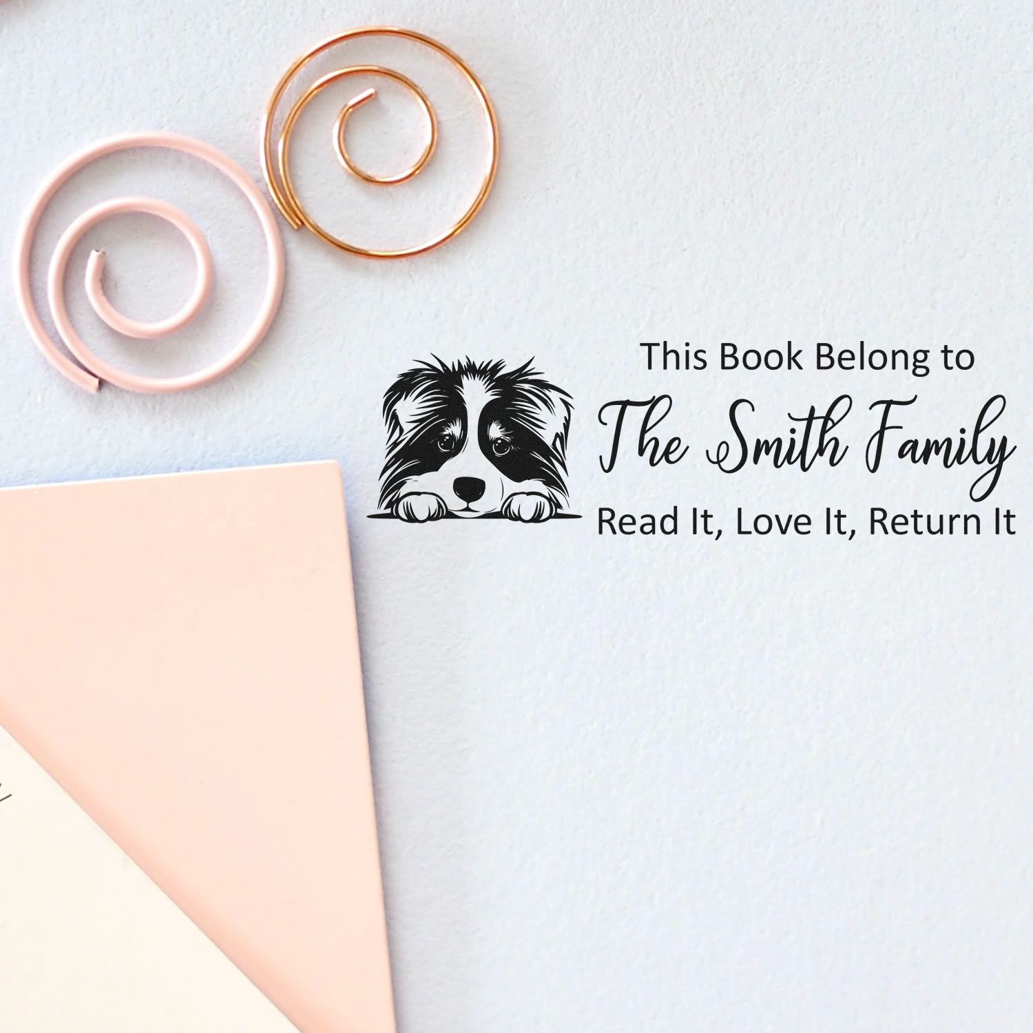 Personalized book rubber stamp with dog design for The Smith Family, reading reminder: Read It, Love It, Return It.