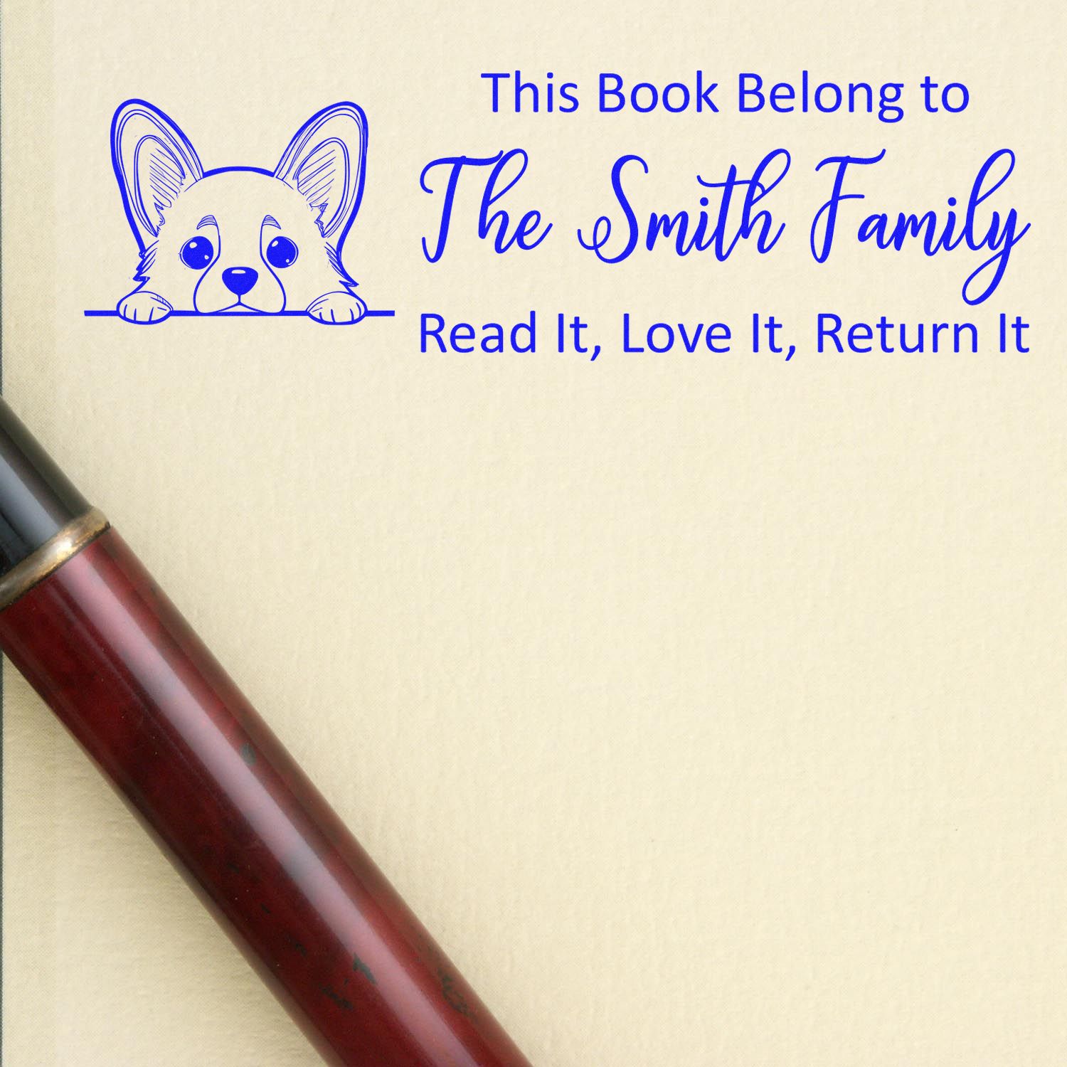 Personalized rubber book stamp with corgi and “This Book Belong to The Smith Family, Read It, Love It, Return It” text.