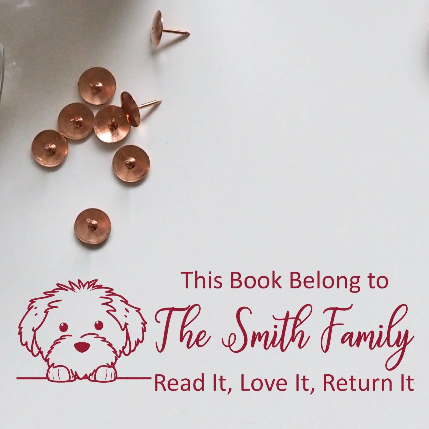 Personalized rubber book stamp with dog graphic for library books: This Book Belongs to The Smith Family, Read It, Love It, Return It.
