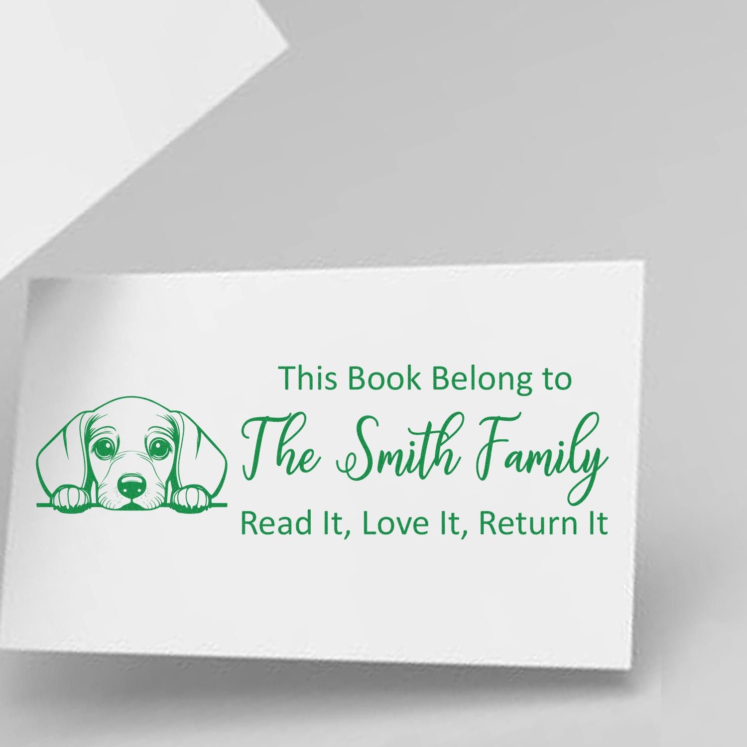 Personalized dog book stamp reading This Book Belong to The Smith Family, Read It, Love It, Return It for library books.