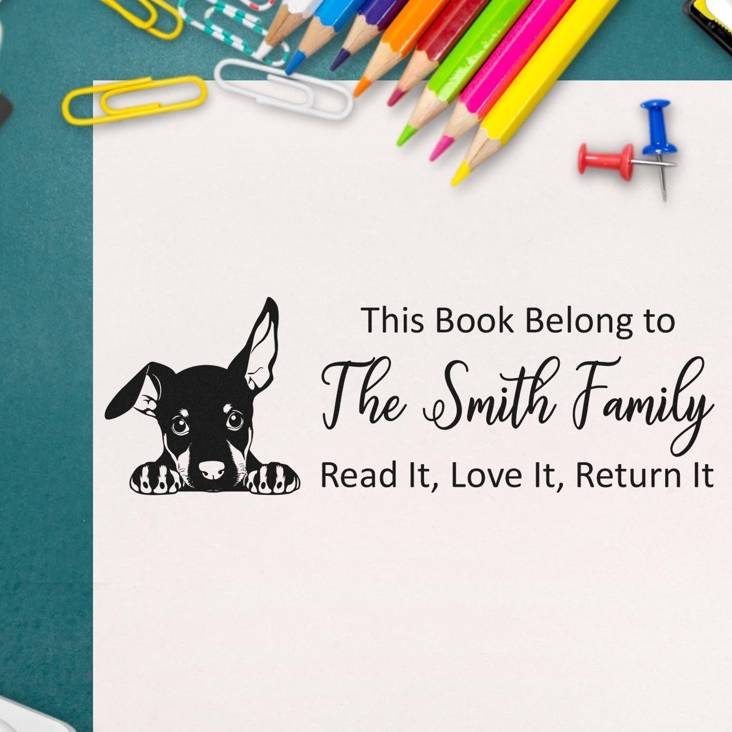 Personalized rubber stamp bookplate with dog art and Read It, Love It, Return It for The Smith Family books.