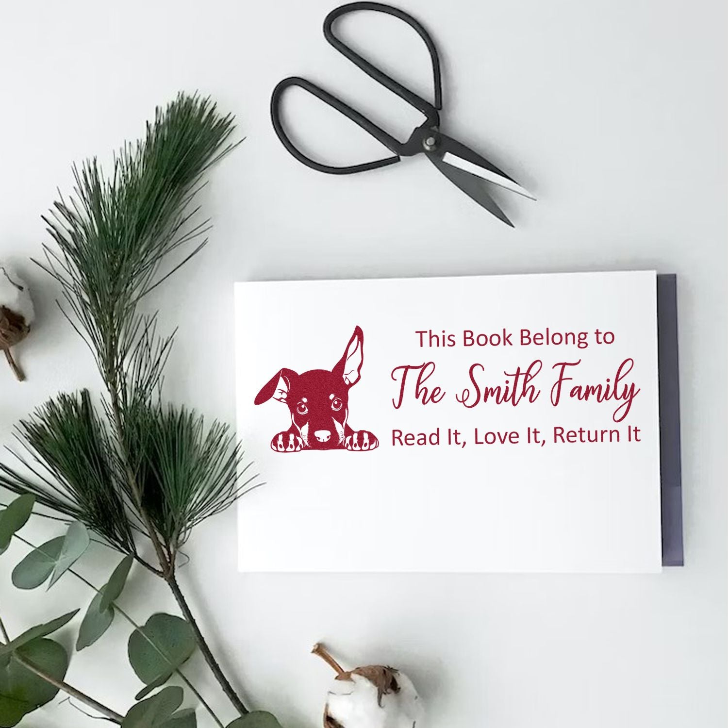 Custom rubber stamp bookplate with dog graphic for books: This Book Belongs to The Smith Family, Read It, Love It, Return It.