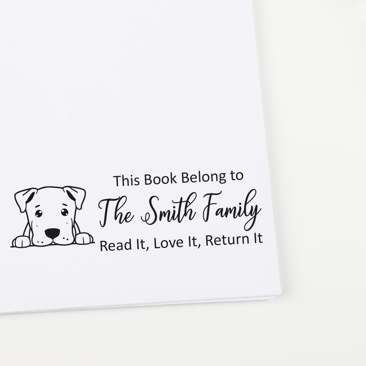 Custom rubber book stamp with dog design for family library books, reading This Book Belong to The Smith Family, Read It, Love It, Return It.