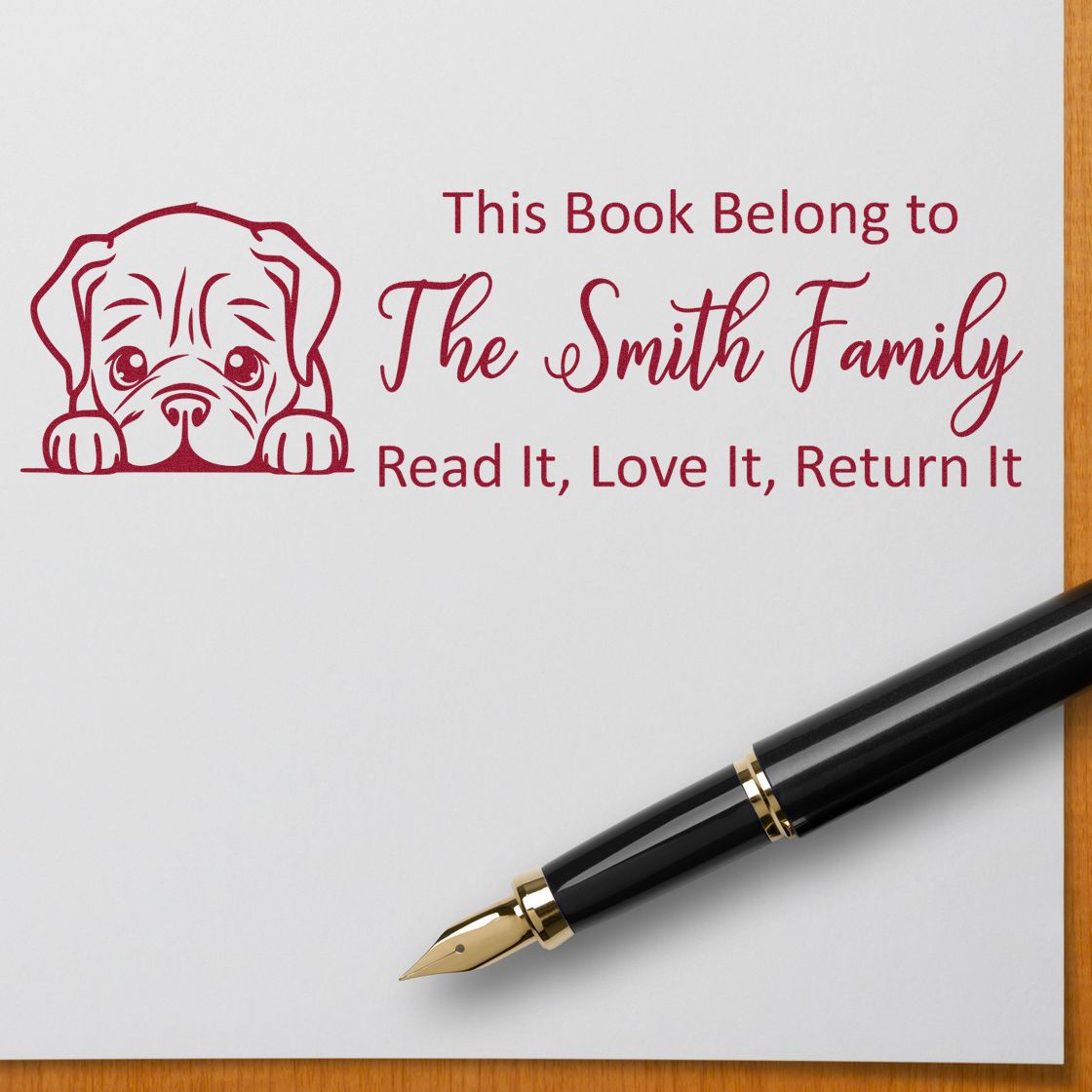 Personalized rubber book stamp with dog design for The Smith Family, reading Read It, Love It, Return It for library books.