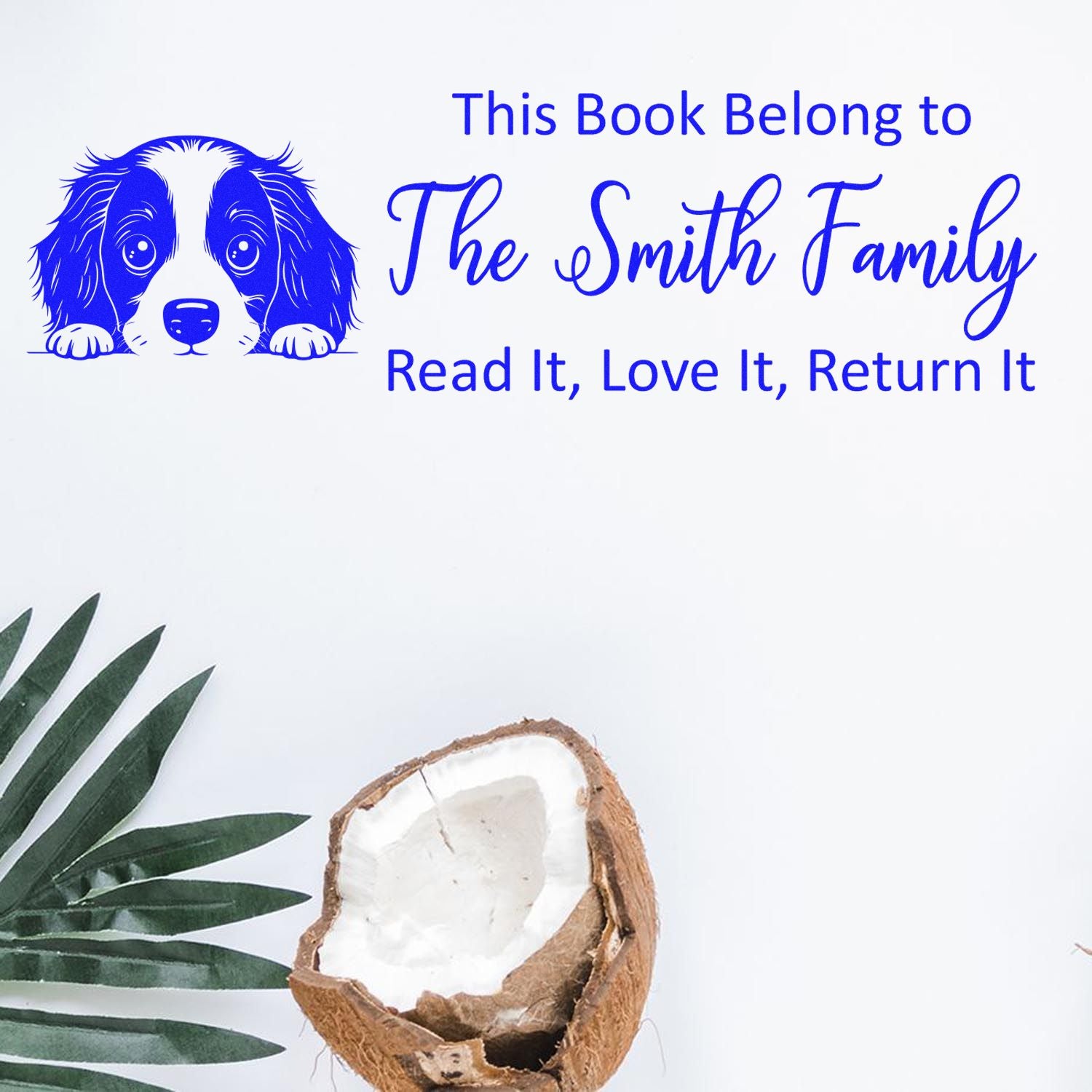 Personalized rubber stamp for books with dog icon and This Book Belongs to The Smith Family, Read It, Love It, Return It text.