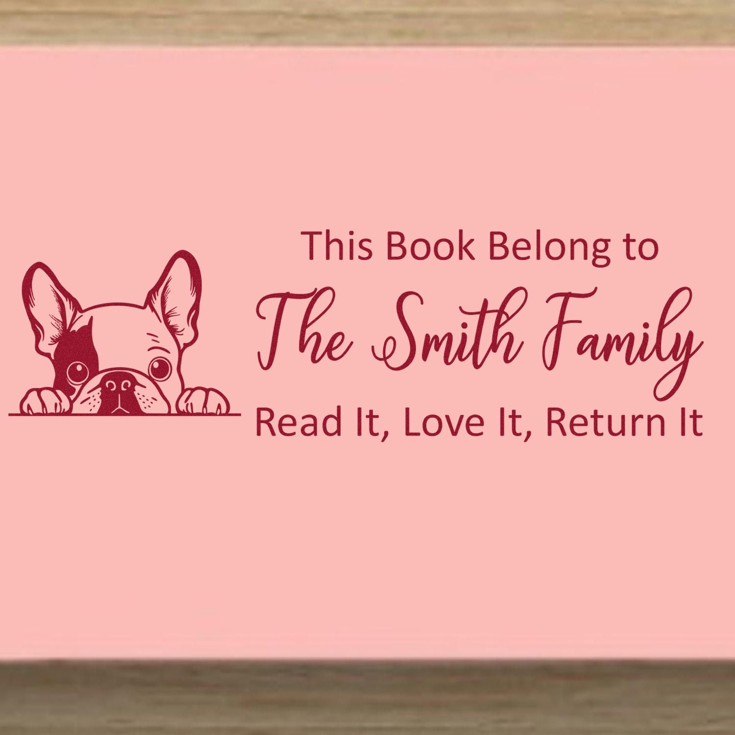 Custom personalized book stamp with dog illustration, This Book Belongs to The Smith Family return message.