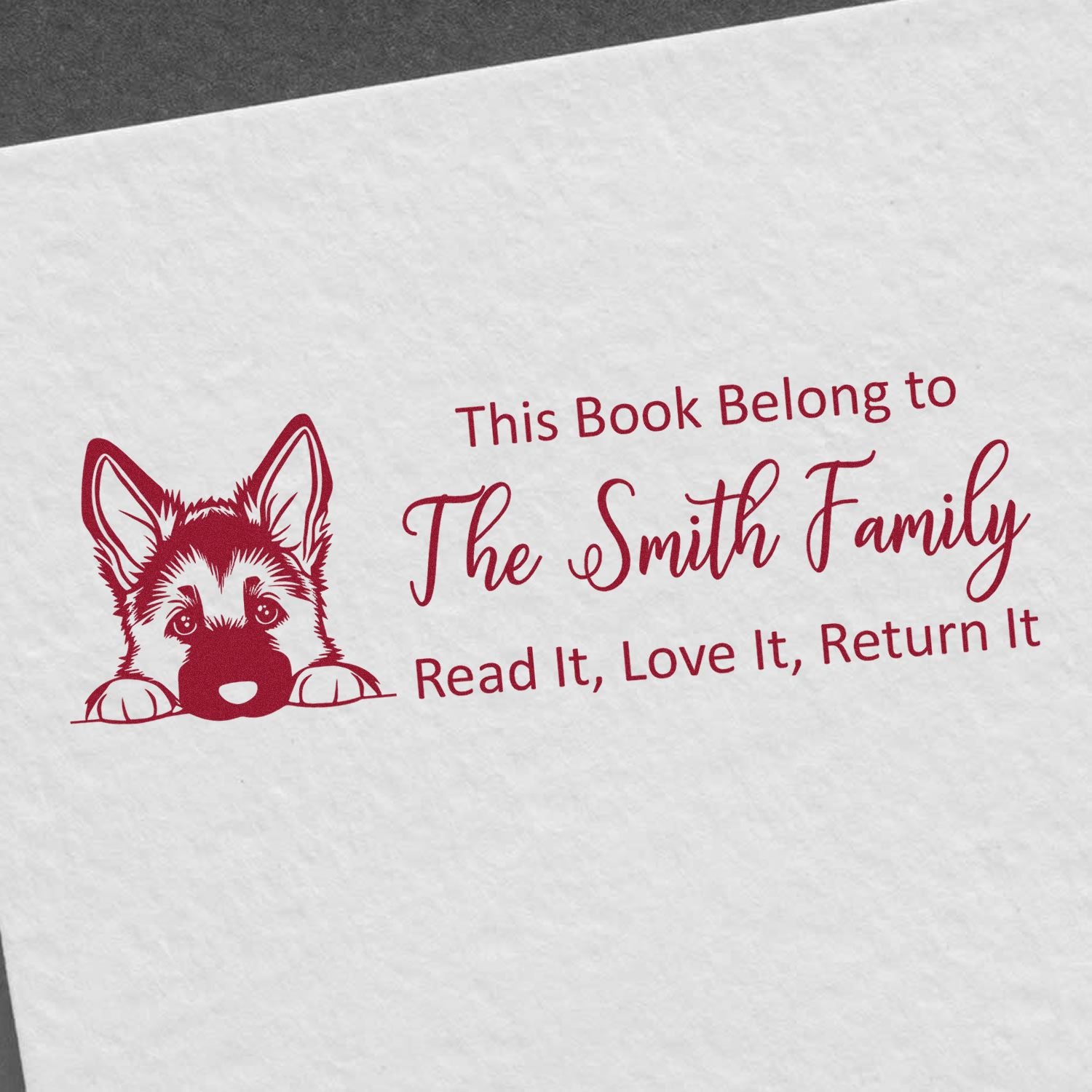 Personalized rubber book stamp for The Smith Family with dog illustration: This Book Belongs to, Read It, Love It, Return It.