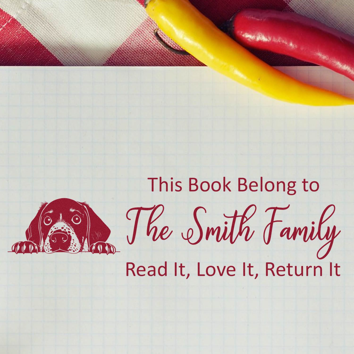 Personalized rubber book stamp with dog illustration: This Book Belongs to The Smith Family, Read It, Love It, Return It.