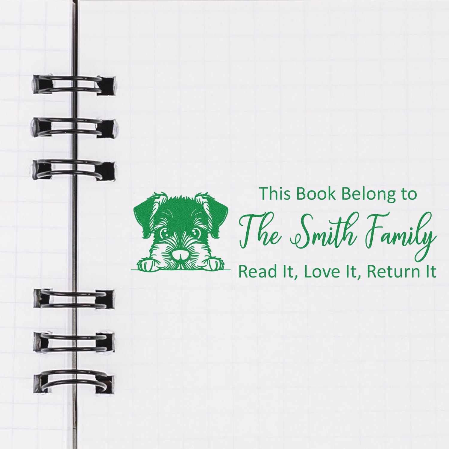 Personalized rubber book stamp with dog graphic and This Book Belong to The Smith Family return message for custom library books.
