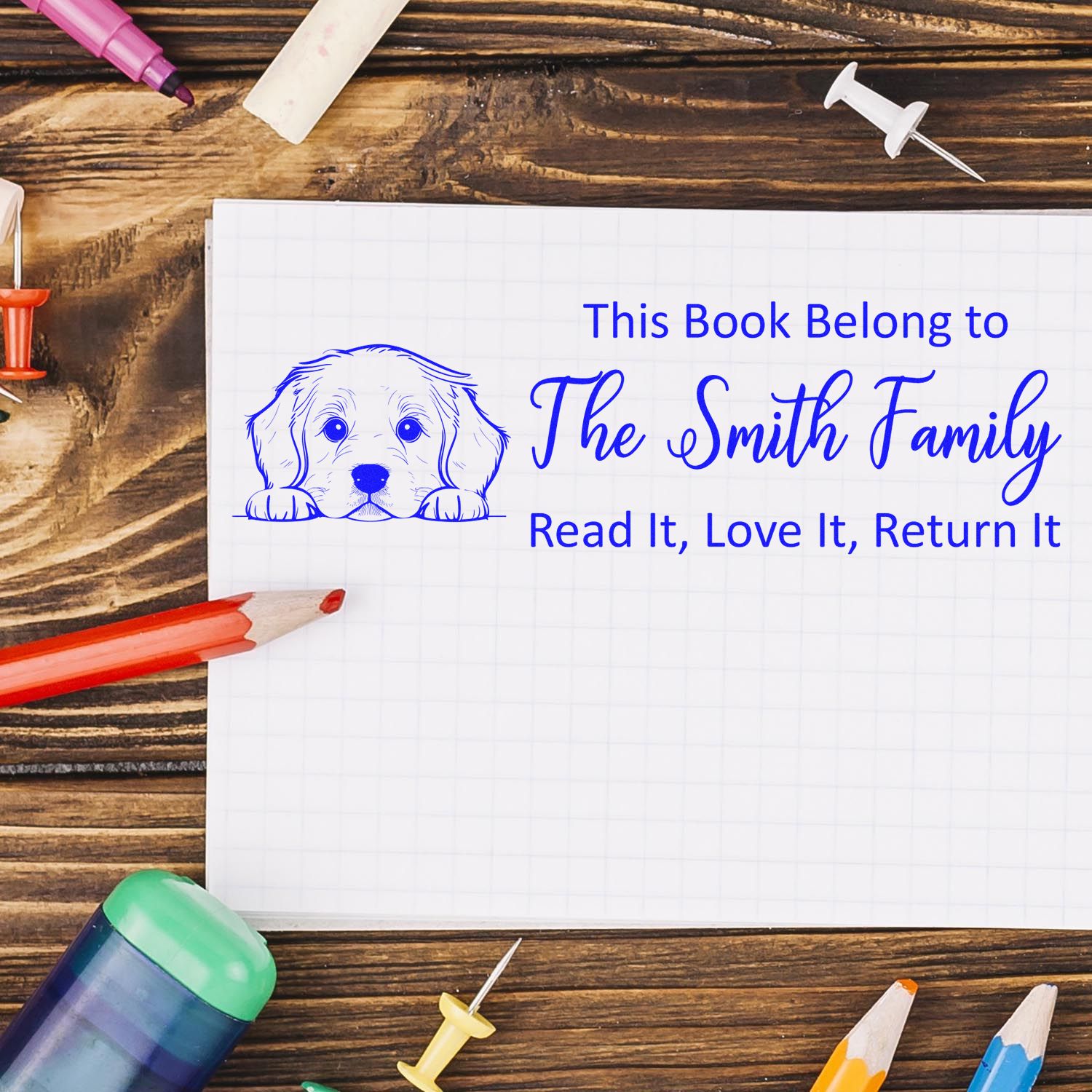 Personalized rubber book stamp with dog design for The Smith Family, reminding readers to return library books.