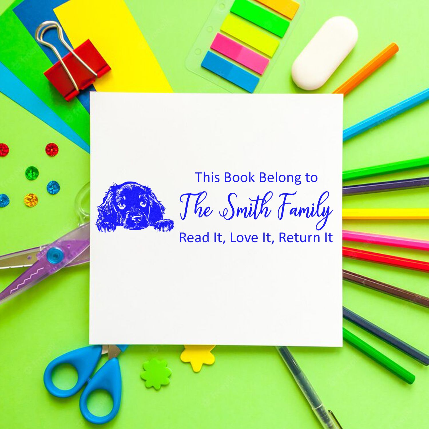 Personalized rubber book stamp with dog design for The Smith Family, featuring a library return message: Read It, Love It, Return It.