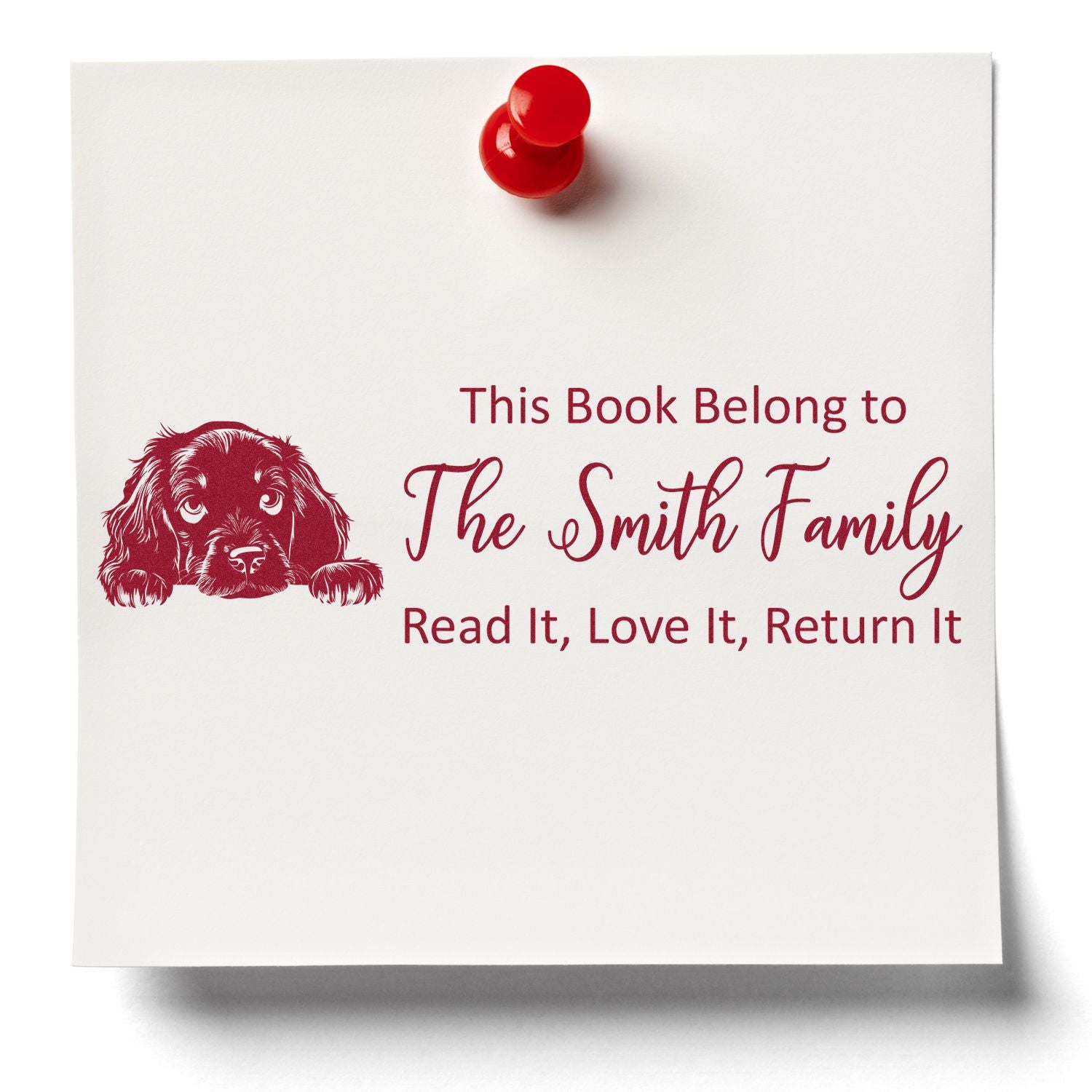 Personalized book rubber stamp with dog illustration and This Book Belongs to The Smith Family return message.