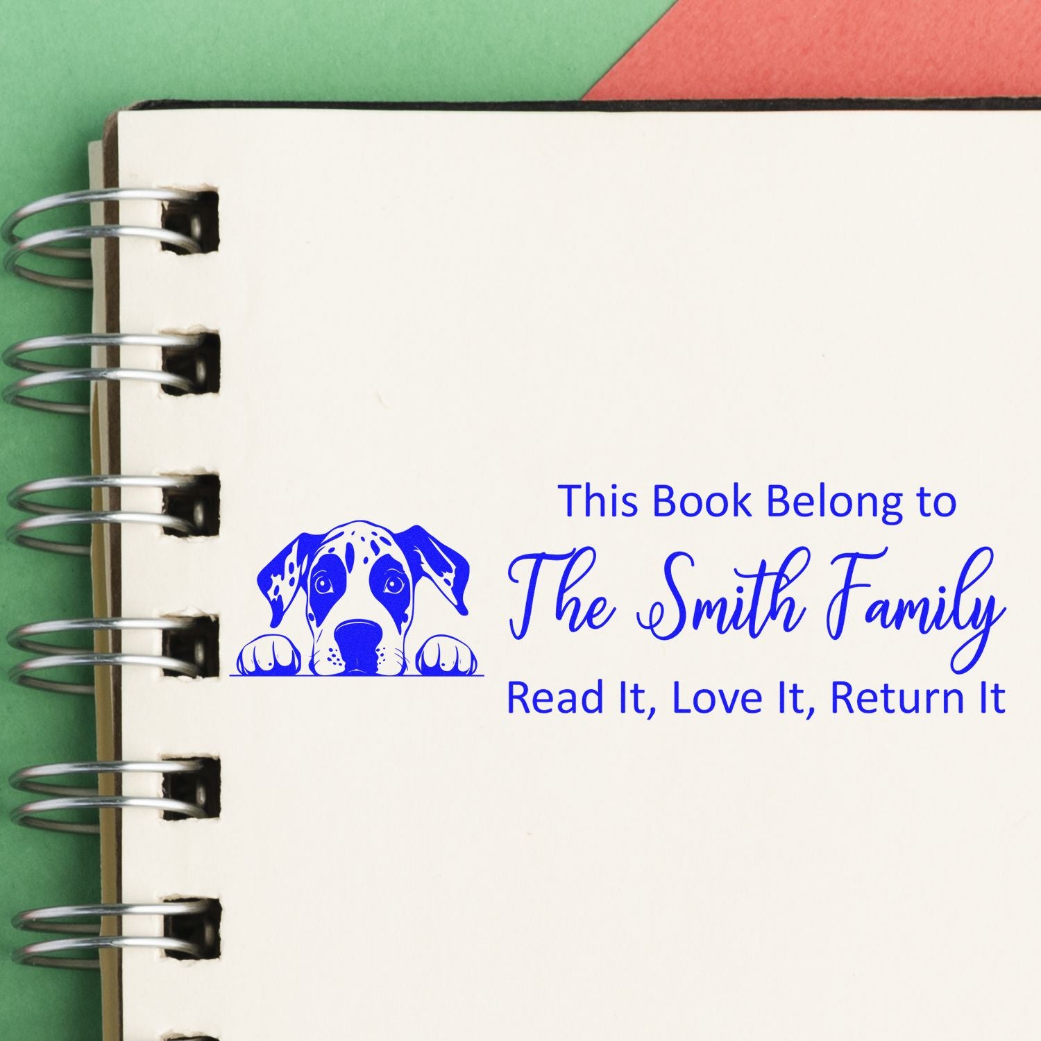 Custom rubber book stamp for The Smith Family with dog graphic and Read It, Love It, Return It ownership message.