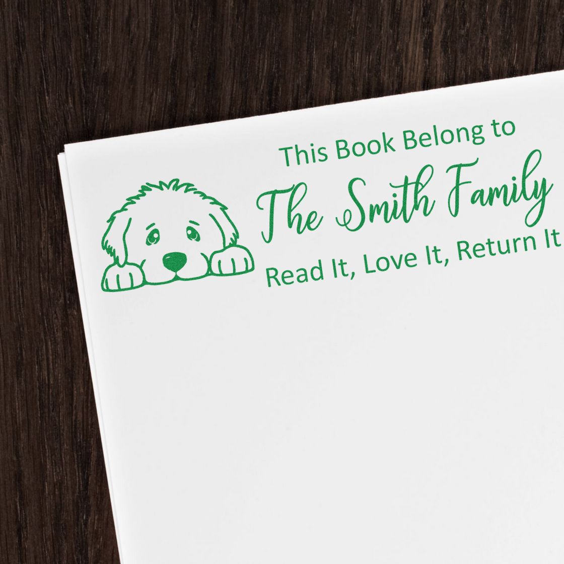 Personalized book rubber stamp with dog illustration for The Smith Family, reading: This Book Belong to The Smith Family, Read It, Love It, Return It.