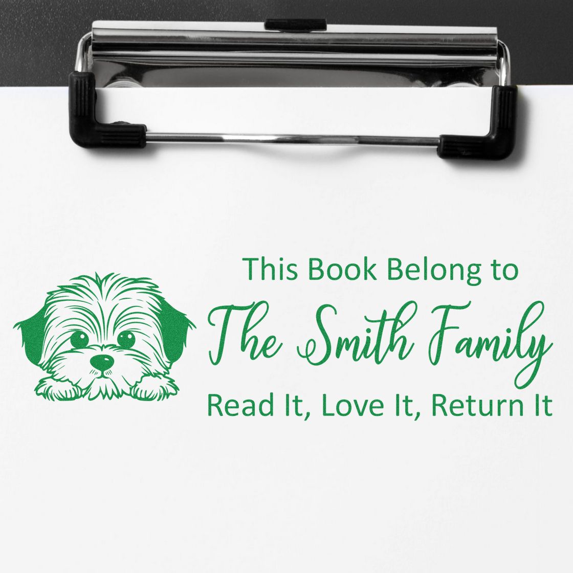 Personalized book stamp rubber stamp with dog illustration and This Book Belongs to The Smith Family return-it message.