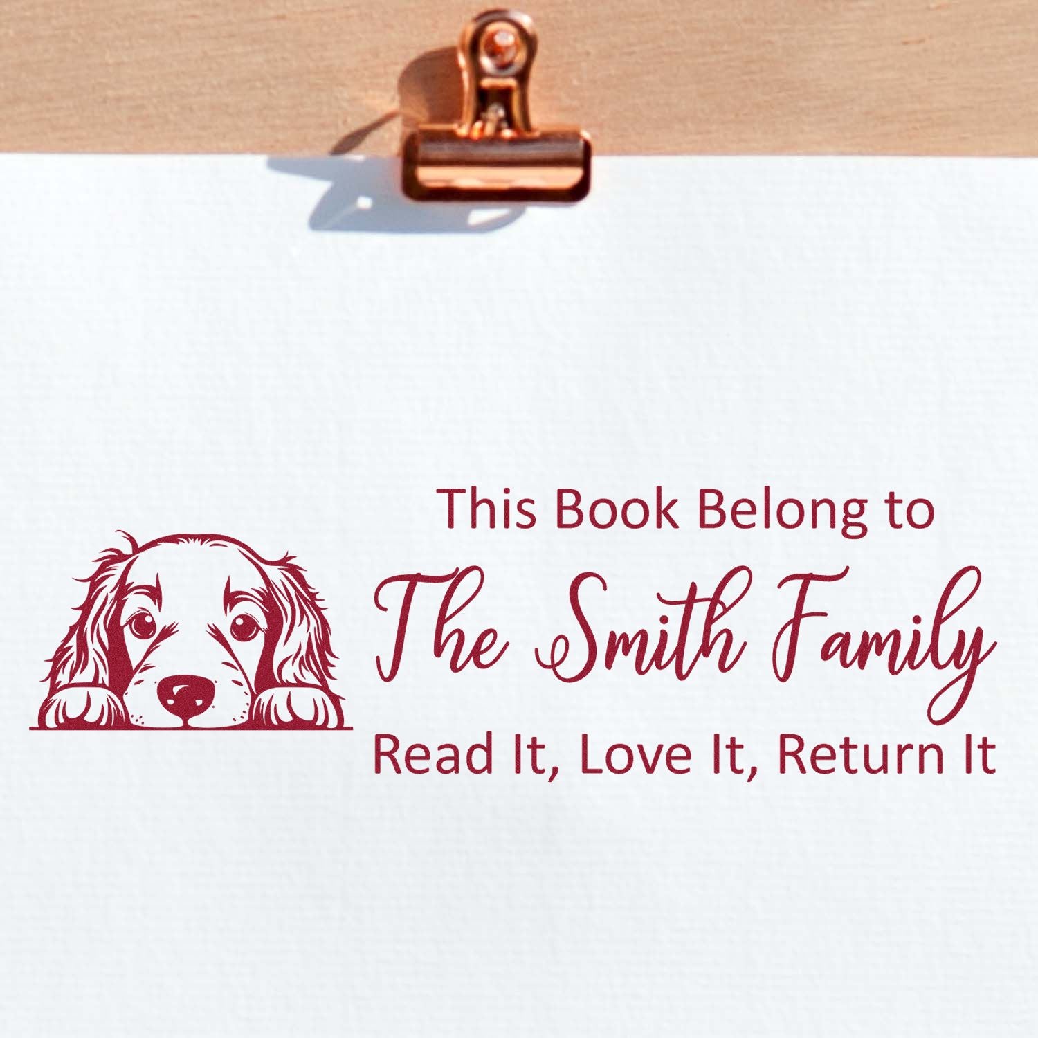Personalized book stamp with dog design for The Smith Family; custom library ownership message, Read It, Love It, Return It.