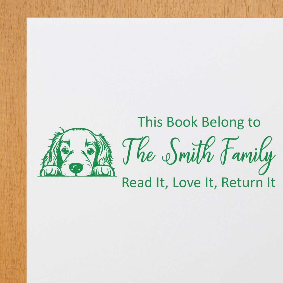Custom rubber stamp for books with dog illustration and text: This Book Belongs to The Smith Family, Read It, Love It, Return It.
