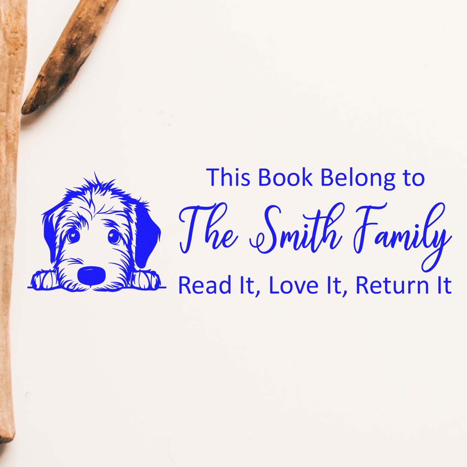 Custom rubber book stamp with dog graphic and family name, reading This Book Belongs to The Smith Family, Read It, Love It, Return It.