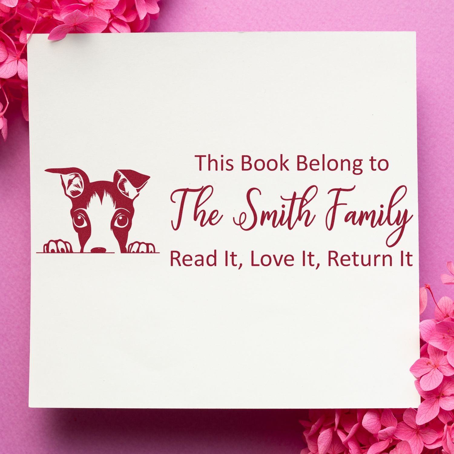 Personalized rubber book stamp with dog design, This Book Belongs to The Smith Family and Read It, Love It, Return It text.