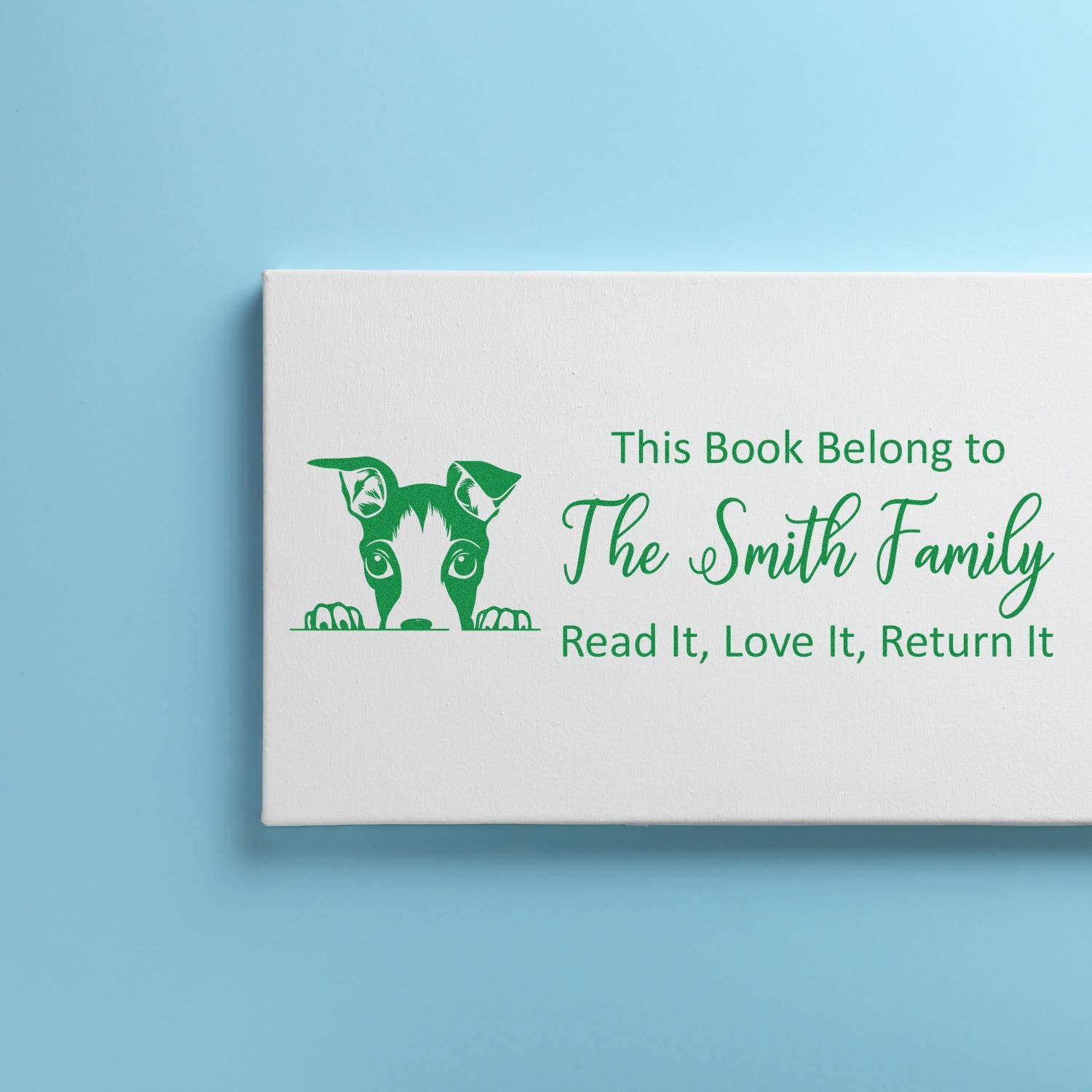 Personalized book return rubber stamp with dog design for The Smith Family library books.