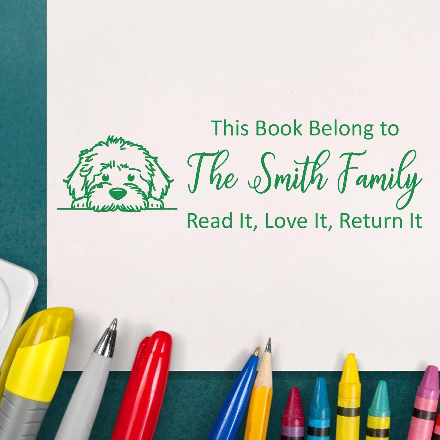 Personalized rubber book stamp with dog design for The Smith Family, saying Read It, Love It, Return It.