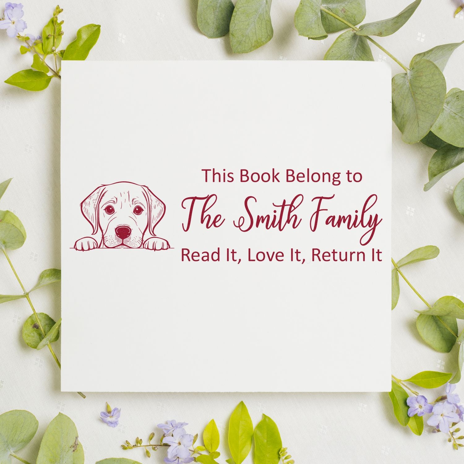 Personalized dog book stamp with puppy illustration and This Book Belong to The Smith Family return-it message for kids books.