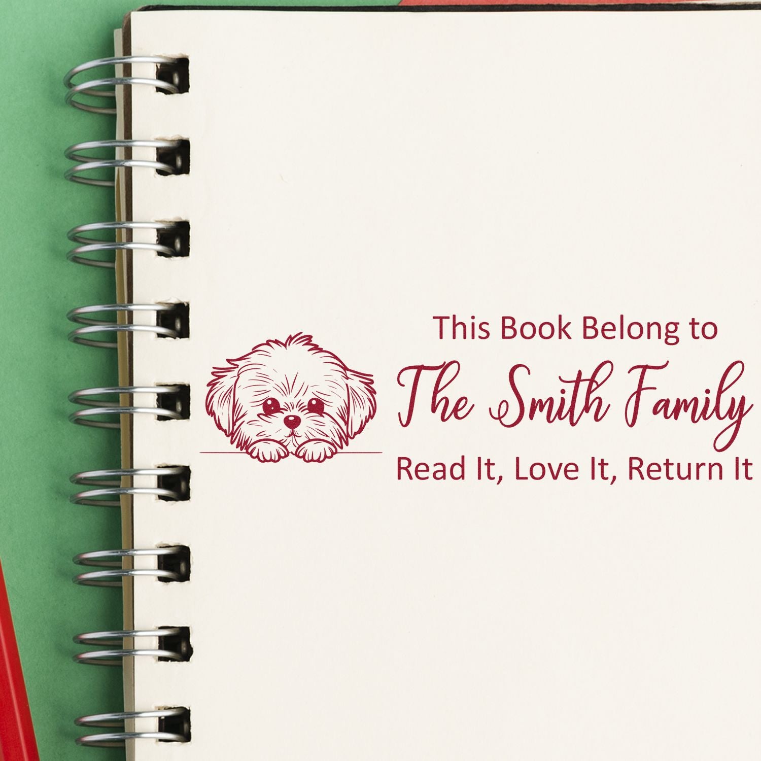 Personalized book return rubber stamp with dog illustration and Smith Family ownership message.