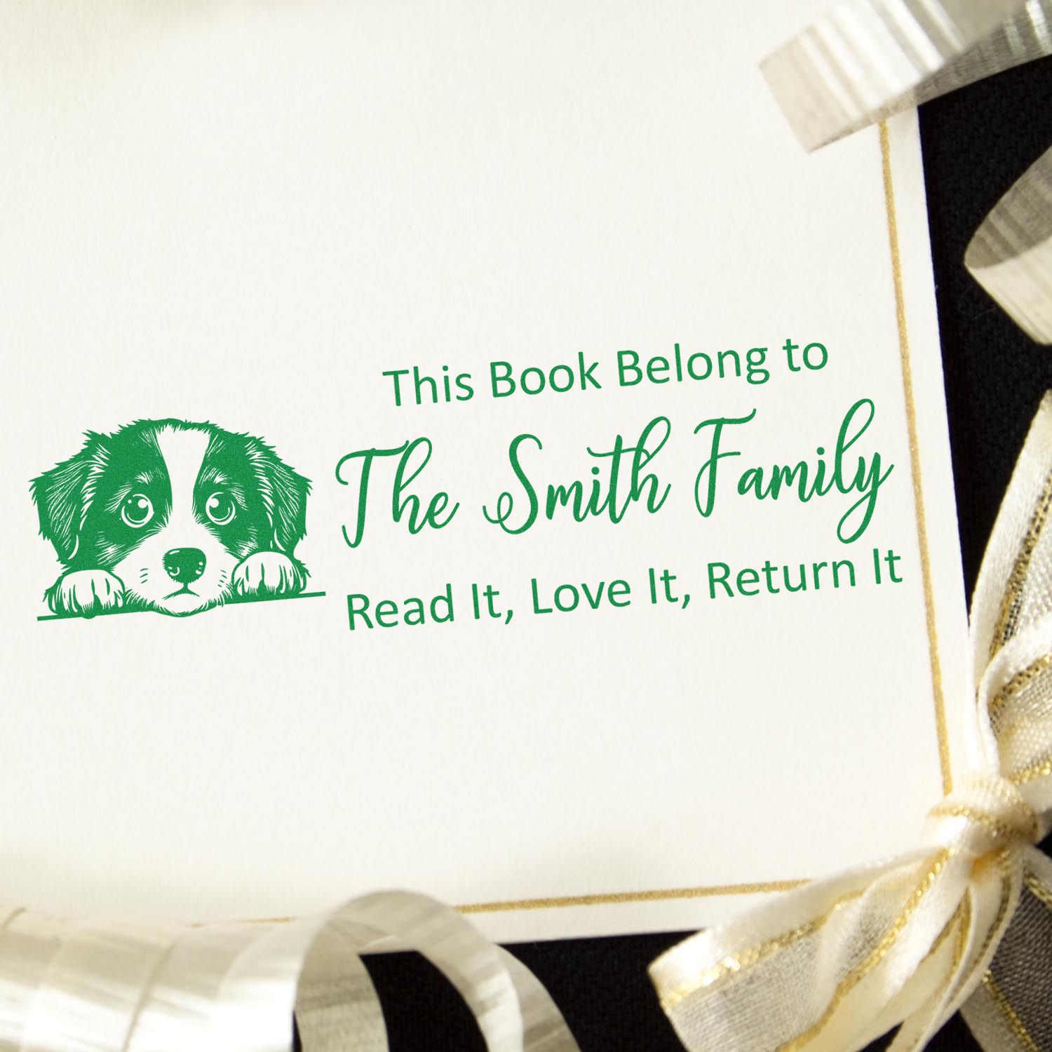 Custom rubber book stamp with dog illustration and This Book Belongs to The Smith Family return message for personal library books.
